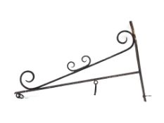 Wrought metal wall mounted bracket for hanging sign/basket, decorated with scroll work,