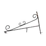 Wrought metal wall mounted bracket for hanging sign/basket, decorated with scroll work,