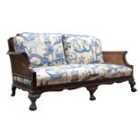 Edwardian George lll style mahogany double caned bergere sofa,