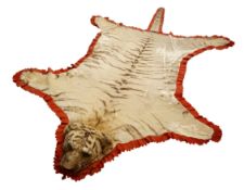 Taxidermy - Early 20th century Tiger skin rug with head mount, glass eyes, limbs outstretched,