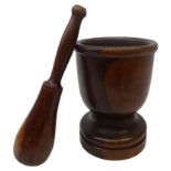 19th century turned lignum vitae pestle & mortar, turned goblet shaped mortar on circular base,