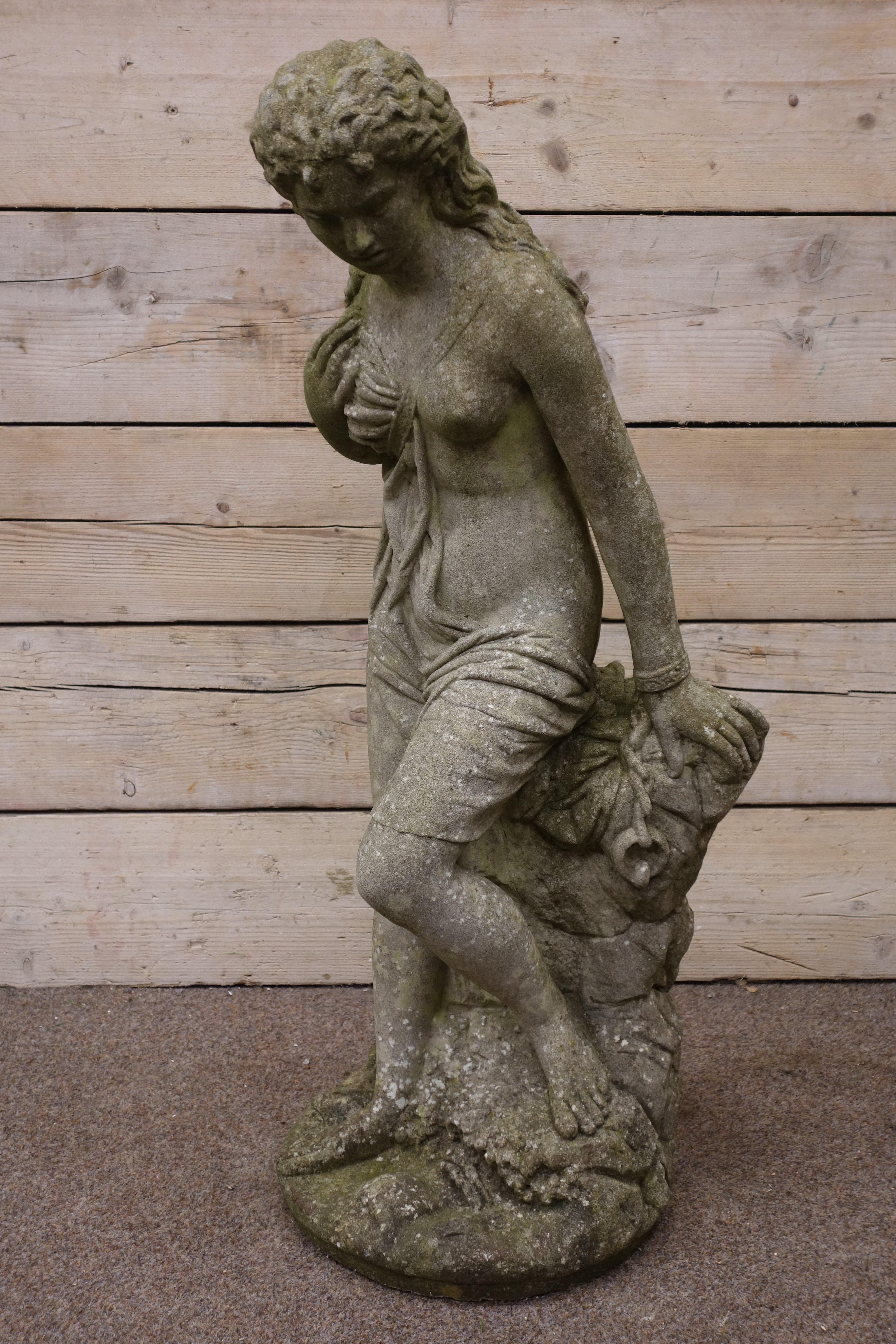 Composite stone garden sculpture of a semi-clad young Lady, on naturalistic circular base, - Image 3 of 4
