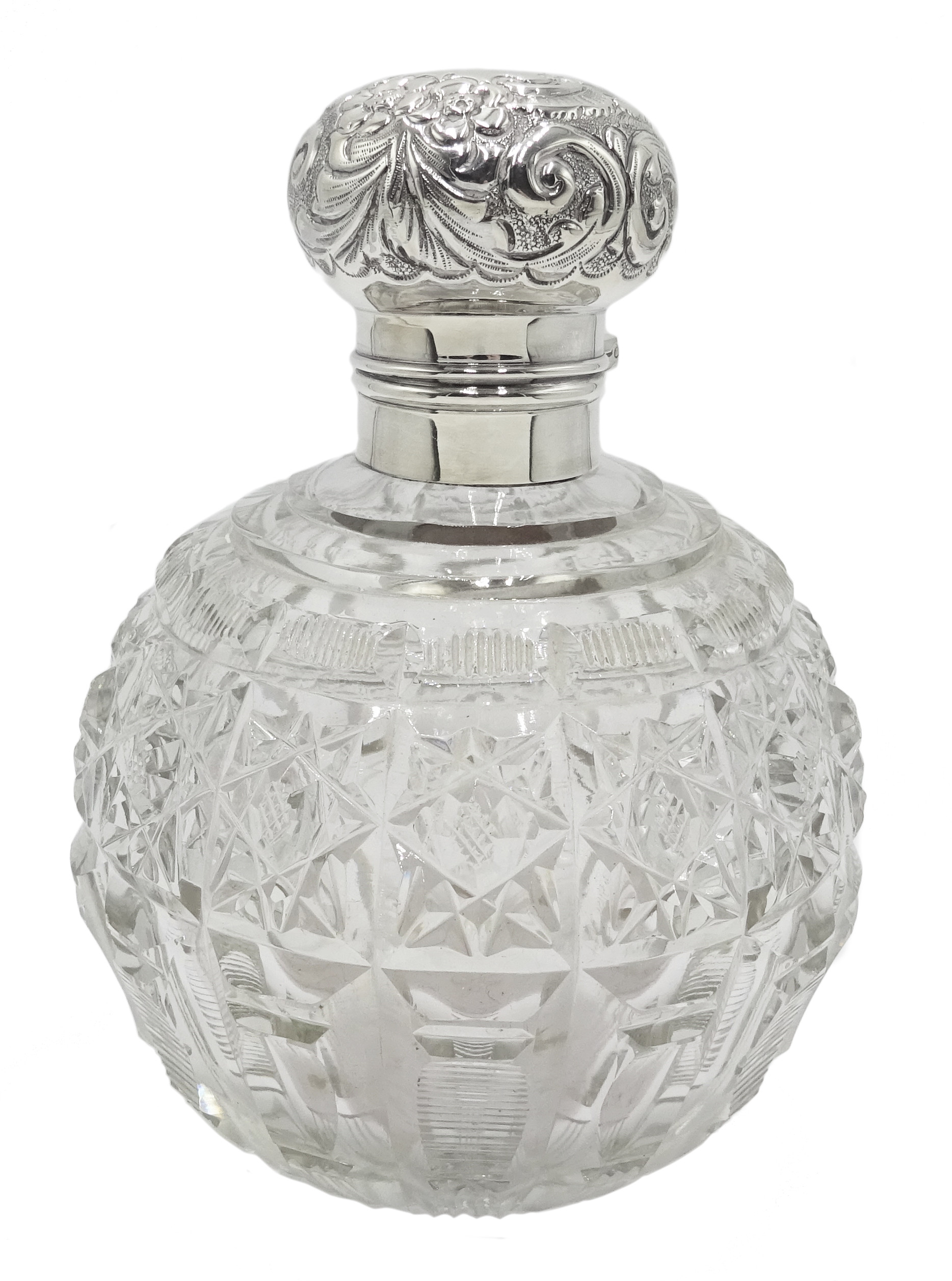 Edwardian silver mounted globular cut glass scent bottle decorated with embossed flowers and