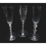 Three ale glasses comprising: round funnel bowl engraved with hops and barley above opaque