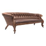 Late 19th century carved walnut framed nailed brown leather upholstered Chesterfield sofa,