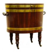 Regency mahogany brass bound oval wine cooler, hinged lid enclosing lead lined interior,