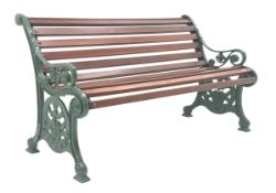 Early 20th century garden bench seat, the cast iron ends with scroll feet decorated with Thistle,