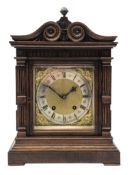 Late 19th century oak mantel clock by Lenzkirch, architectural case with scroll carved top,