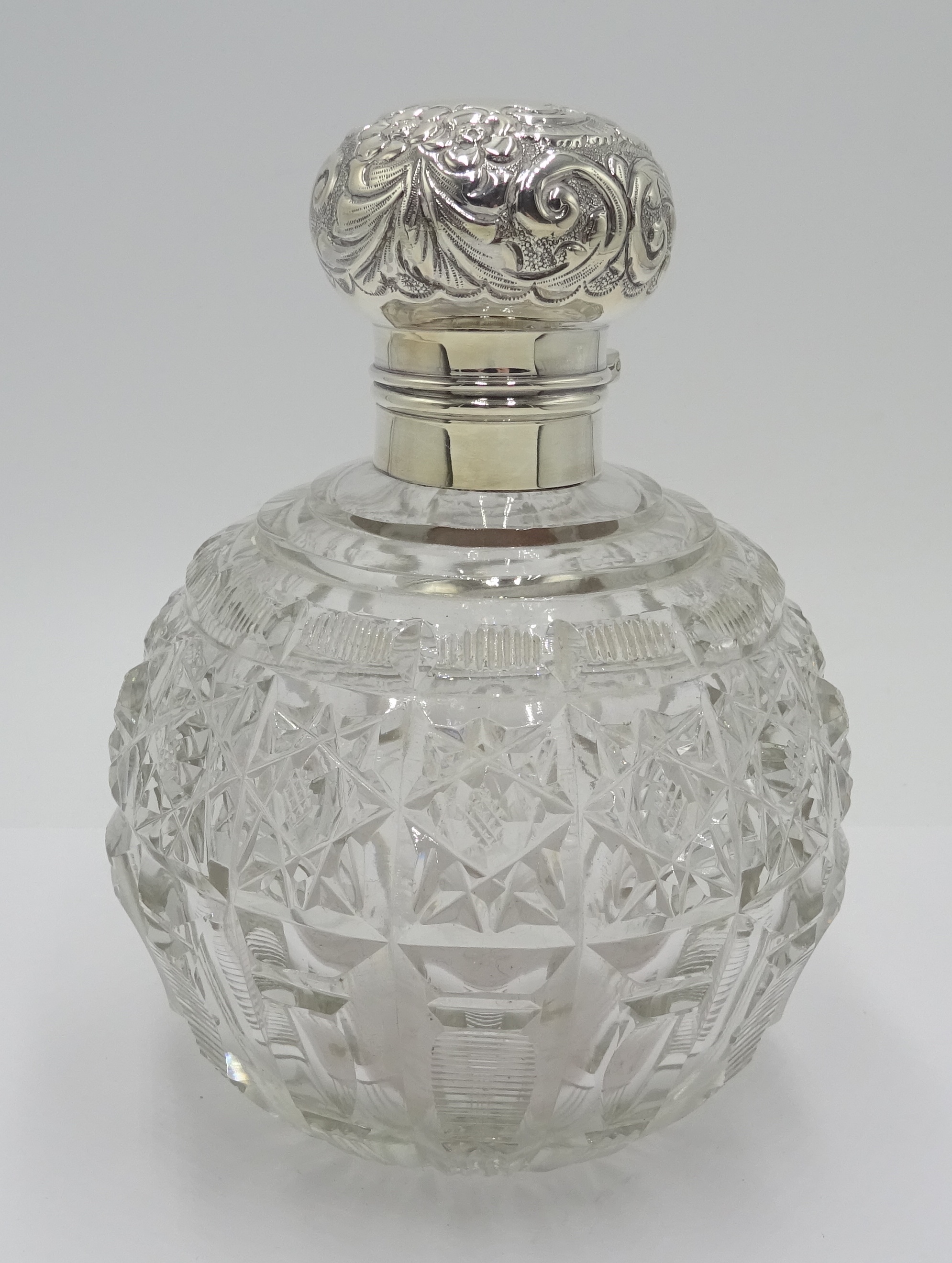 Edwardian silver mounted globular cut glass scent bottle decorated with embossed flowers and - Image 2 of 5