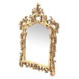 Chippendale style gilt pier mirror, bevelled arched plate in C scroll, acanthus and floral frame,
