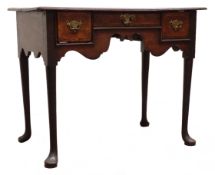 Late 18th century oak low boy, moulded top above three crossbanded drawers with shaped frieze,