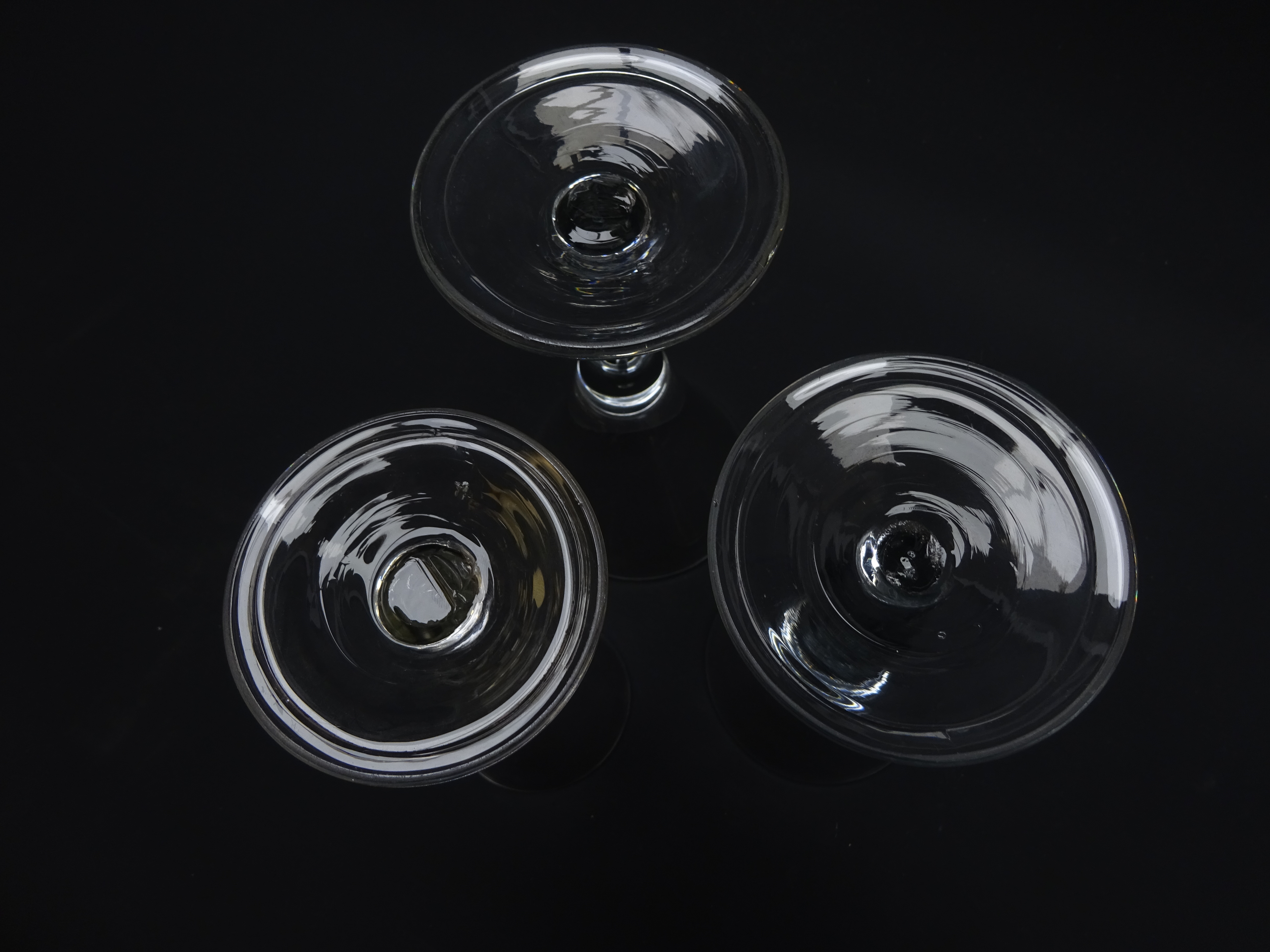 Three wine glasses each with trumpet bowl rising from a thick plain stem enclosing a single tear on - Image 2 of 2