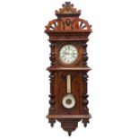 Large Victorian walnut wall clock with aneroid barometer and thermometer,