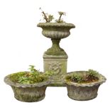 Composite stone circular garden urn, with lobed body on wreath moulded pedestal, H78cm,