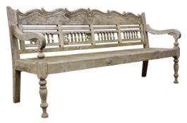 Large hardwood garden bench, baluster turned openwork back with shaped scroll carved top rail,