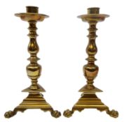 Pair 18th century Dutch brass candlesticks, circular drip pan,