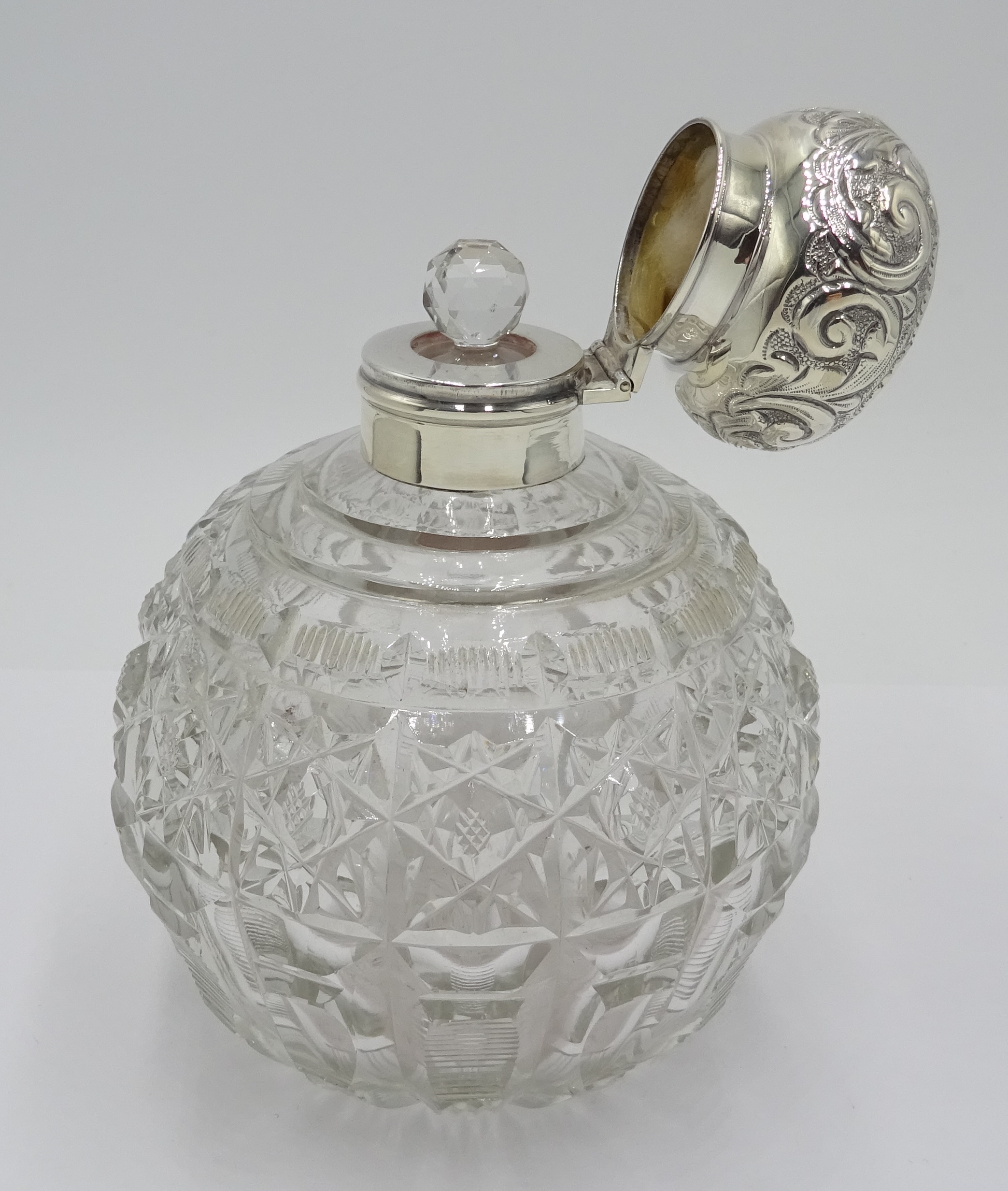 Edwardian silver mounted globular cut glass scent bottle decorated with embossed flowers and - Image 3 of 5