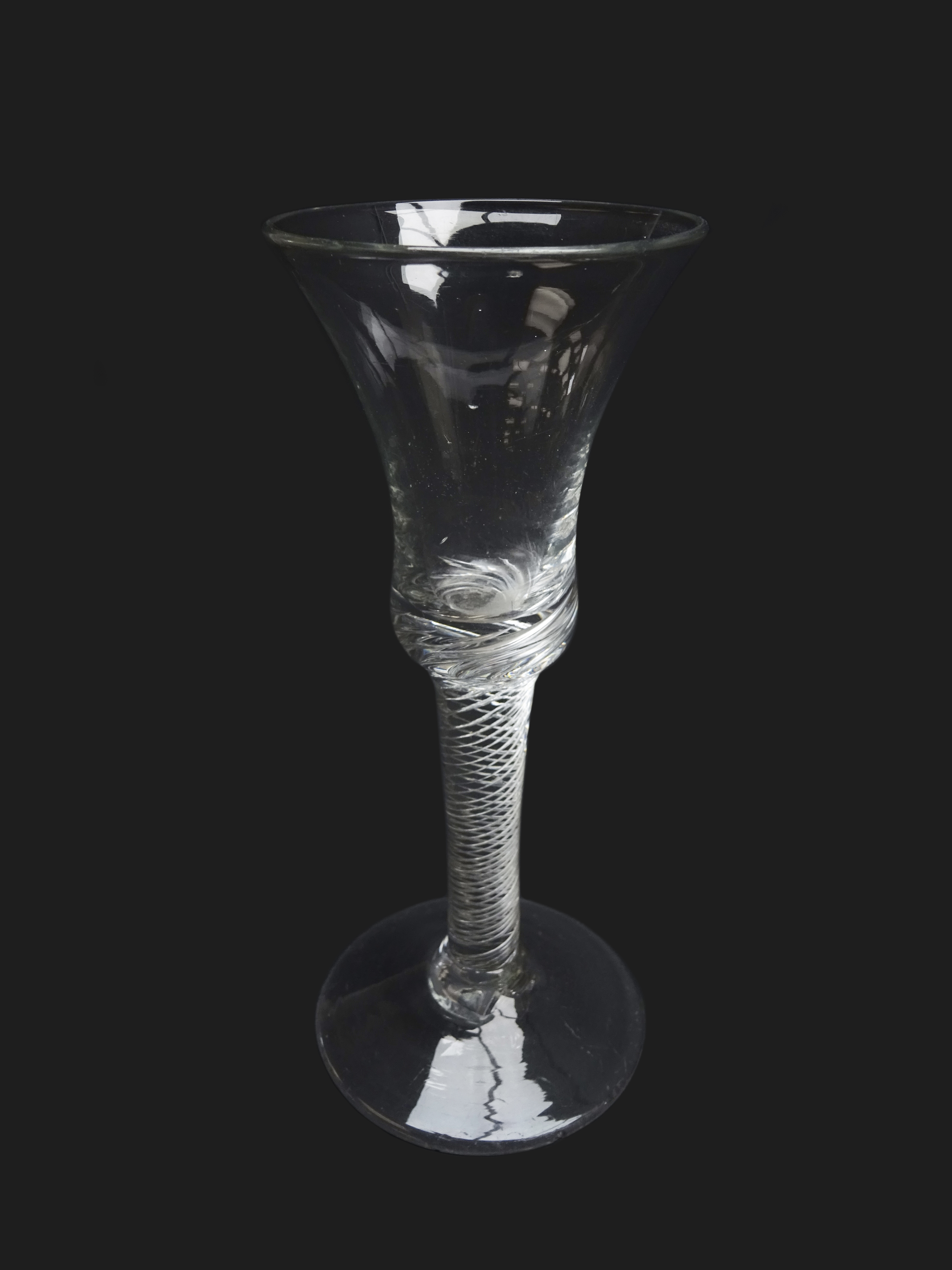 Georgian wine glass, bell shaped bowl, air twist stem and domed foot,