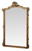 Large 19th century mirror, shaped bevel plate in gilt wood and gesso frame carved with foliage,