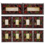 Ten Victorian stained glass panels each having a rectangular frosted glass plate engraved with