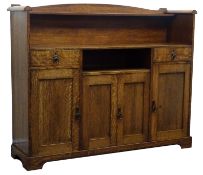 Arts & Crafts oak sideboard, raised arched back with single shelf, above two drawers,