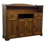 Arts & Crafts oak sideboard, raised arched back with single shelf, above two drawers,