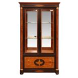 Empire style ebonised banded satinwood display cabinet with brass capped half columns enclosing two