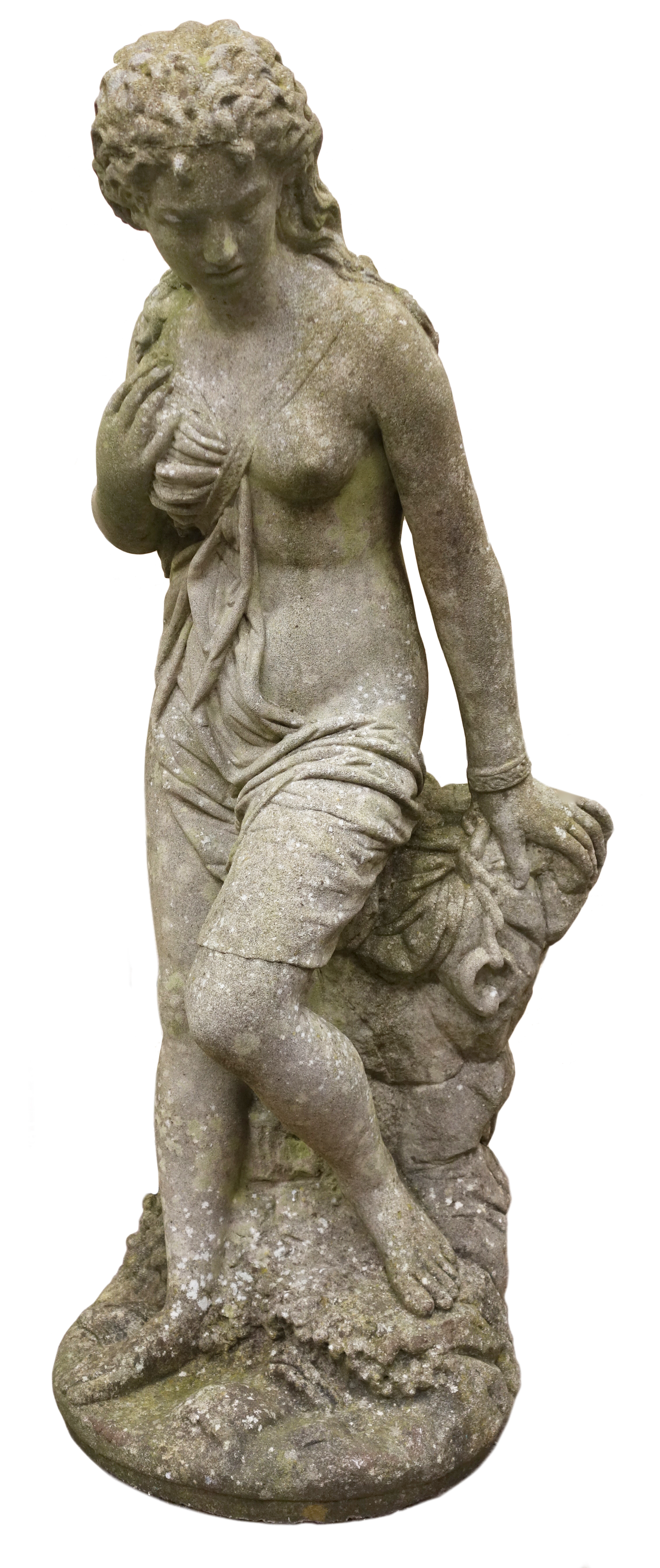Composite stone garden sculpture of a semi-clad young Lady, on naturalistic circular base,