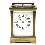 Late 19th century brass Carriage clock with white Roman dial, plain case with bevelled glass plates,