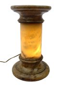 Carved alabaster illuminated pedestal, circular top on cylindrical column with integral light,
