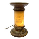 Carved alabaster illuminated pedestal, circular top on cylindrical column with integral light,