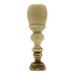 19th century desk seal, turned ivory handle with gilt metal base, lacking seal matrix, L9.