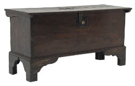 Small George lll planked oak coffer, hinged top with chip carved sides and brass nailed initials AE,