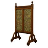 Arts & Crafts oak framed fire screen, two glazed doors enlcosing floral tapestry panel,