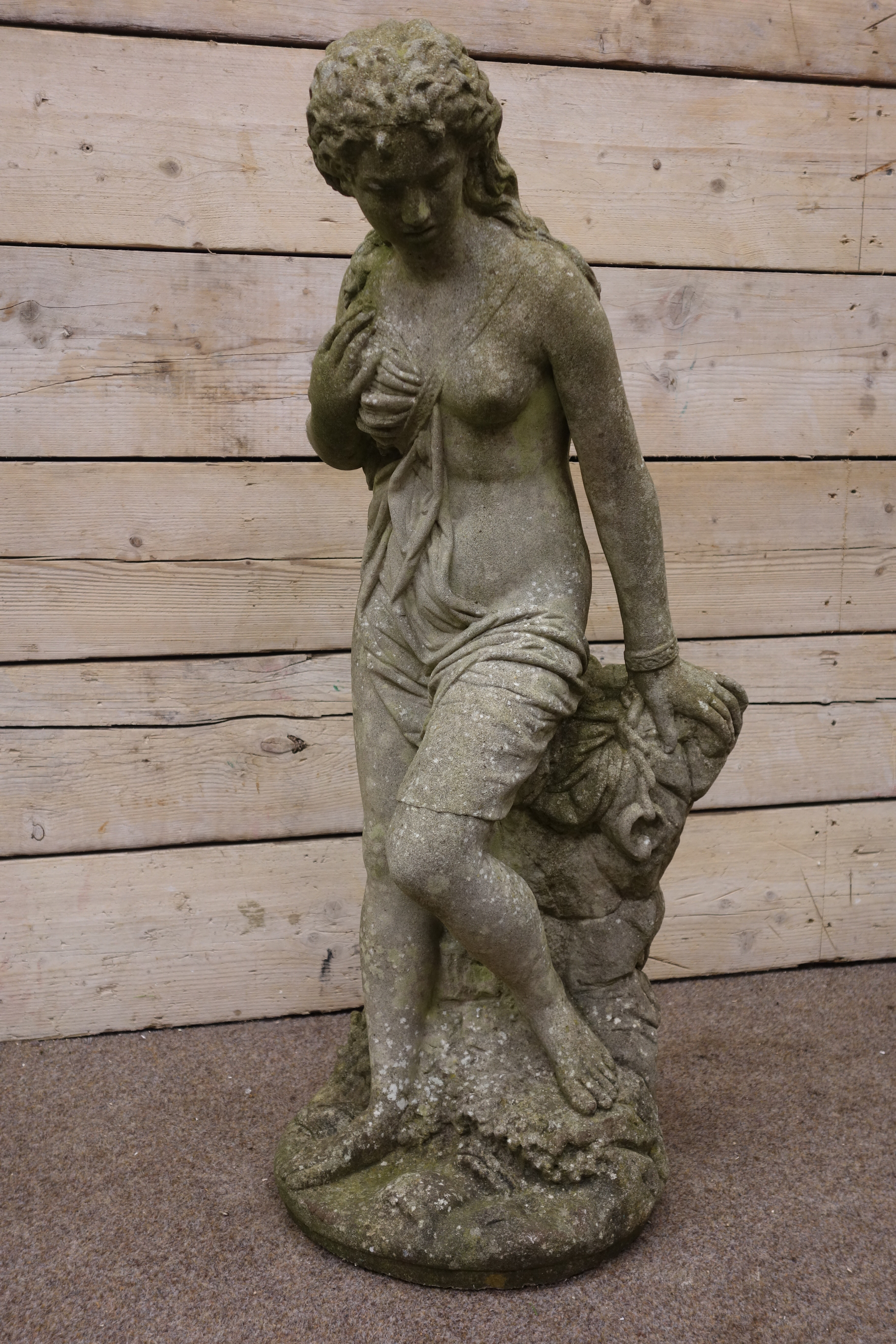 Composite stone garden sculpture of a semi-clad young Lady, on naturalistic circular base, - Image 2 of 4