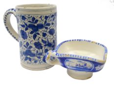 19th century Delft sauceboat, square form, painted with buildings in a landscape,