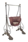Victorian child's cast iron garden swing, shaped seat on curved supports,
