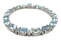 18ct white gold aquamarine and diamond bracelet, stamped 750, aquamarine 12.