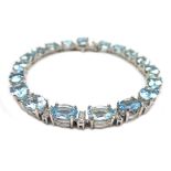 18ct white gold aquamarine and diamond bracelet, stamped 750, aquamarine 12.