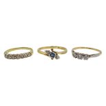 Gold sapphire and diamond crossover ring and three stone diamond ring,