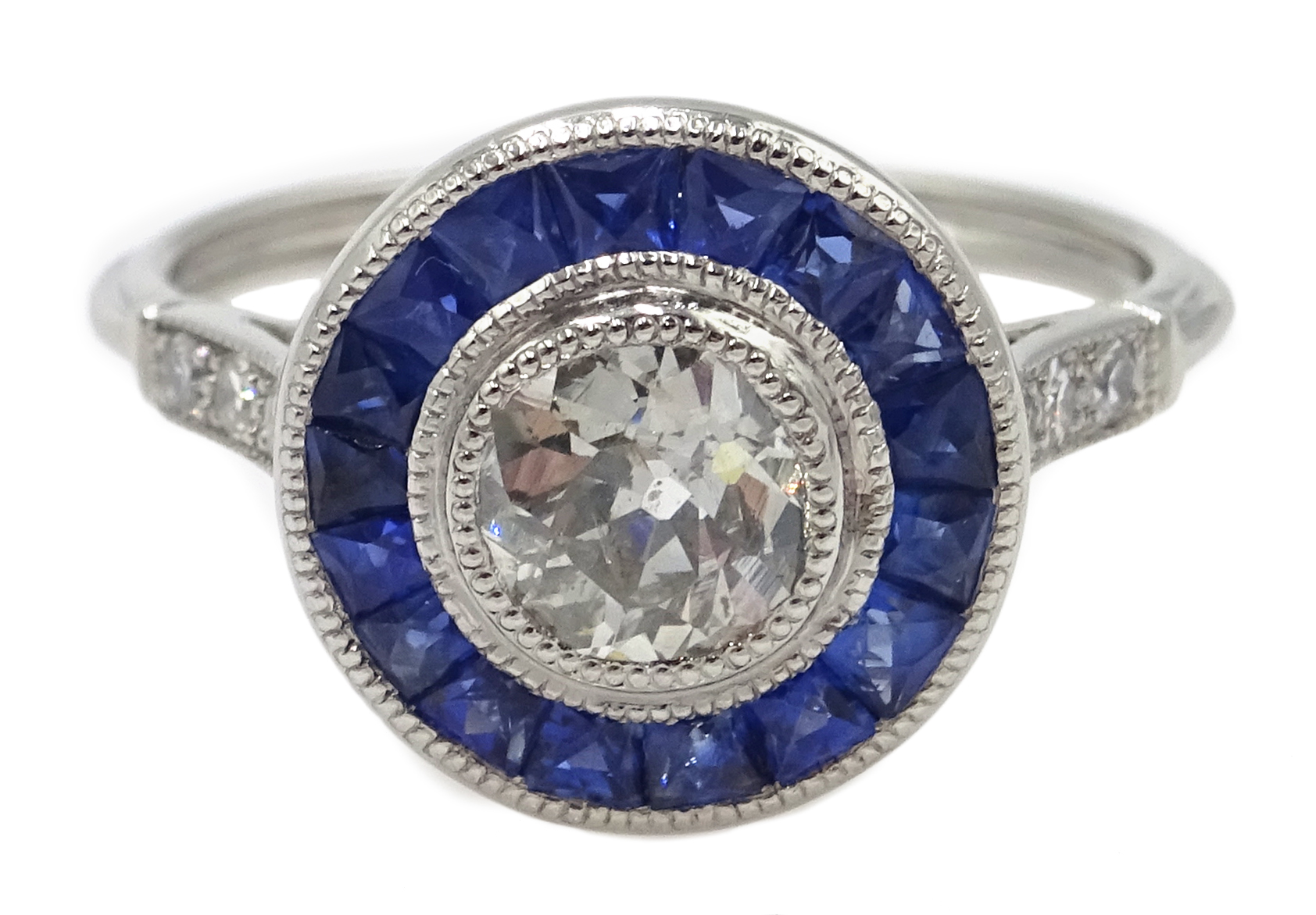 Platinum round old cut diamond and calibre cut sapphire target ring, with diamond shoulders,