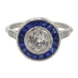 Platinum round old cut diamond and calibre cut sapphire target ring, with diamond shoulders,