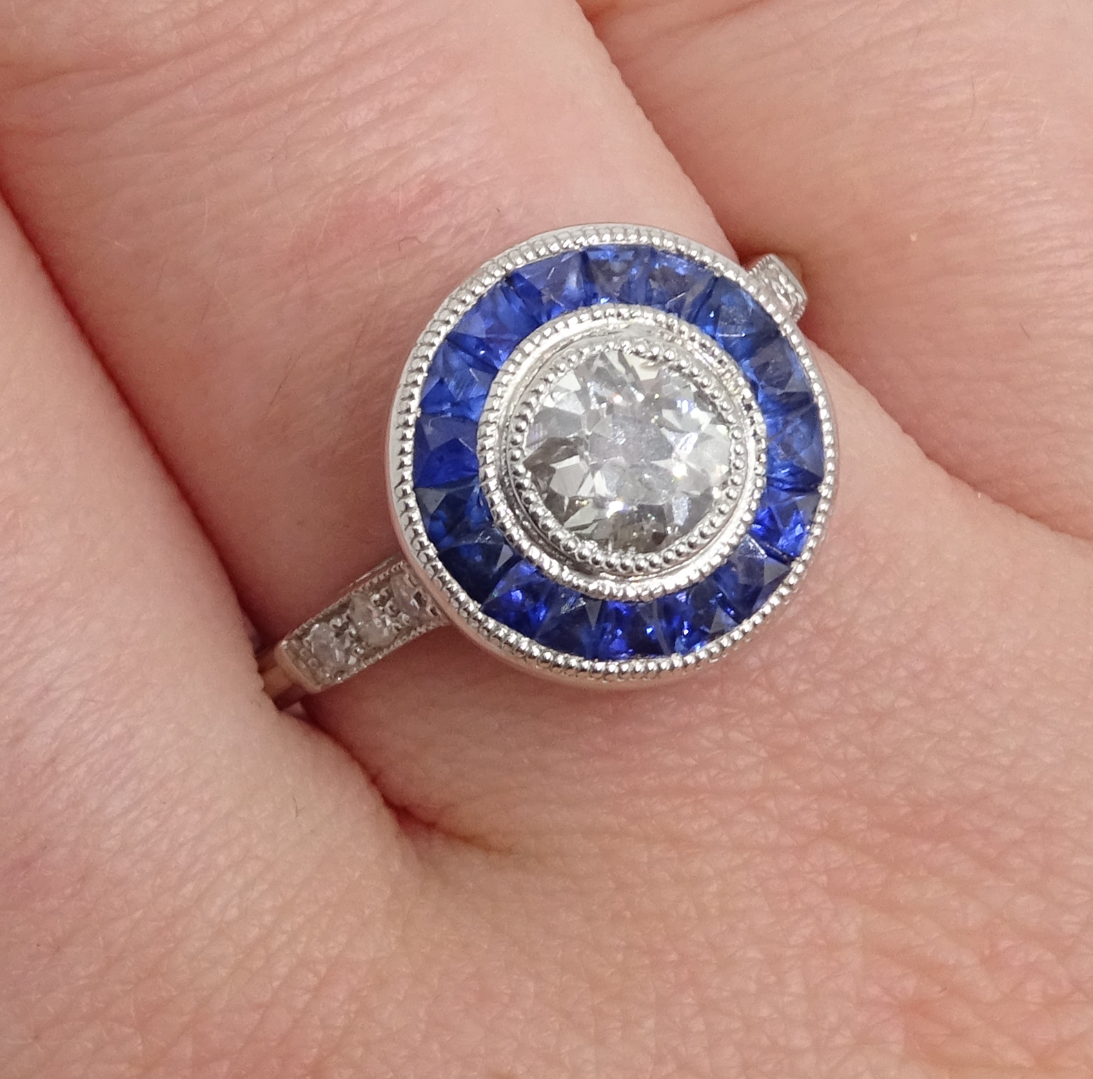 Platinum round old cut diamond and calibre cut sapphire target ring, with diamond shoulders, - Image 2 of 5