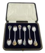 Set of six silver coffee spoons with greyhound enamel terminals and gilded bowls by Northern