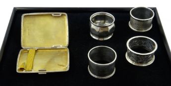 Four silver napkin rings and a silver cigarette case all hallmarked 5oz Condition Report