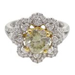 18ct white gold diamond flower cluster ring, the central fancy brilliant cut diamond of approx 1.