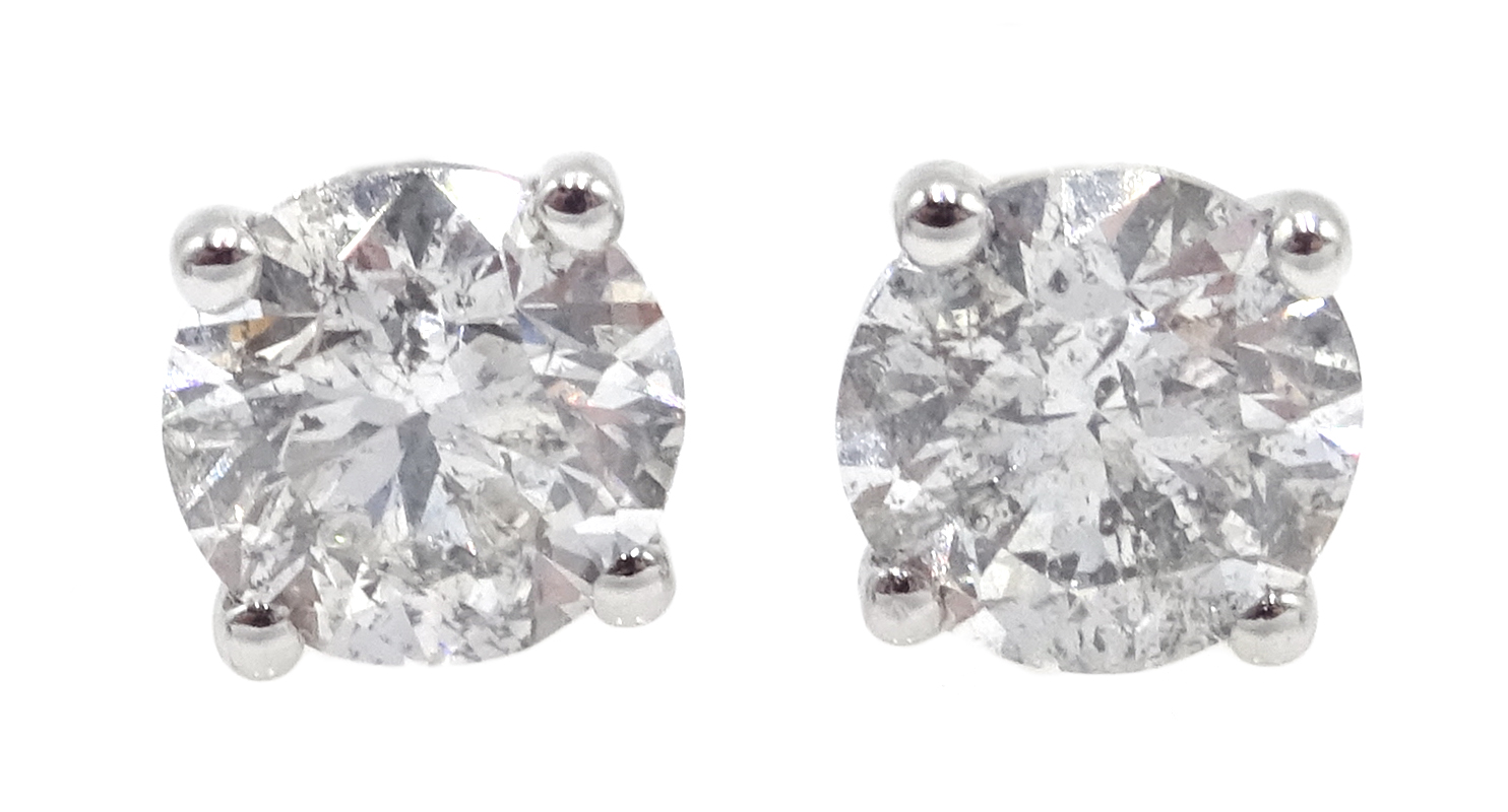 Pair of 18ct white gold round brilliant cut diamond stud earrings, hallmarked,