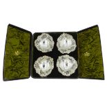 Four Victorian silver heart shaped bon bon dishes, embossed and pierced decoration by Sibray,