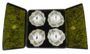 Four Victorian silver heart shaped bon bon dishes, embossed and pierced decoration by Sibray,