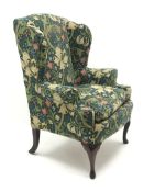 Queen Anne style wing back upholstered armchair, cabriole legs,